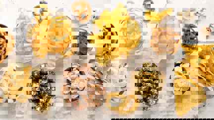 Selection Of Snack Foods Including Crisps, Popcorn And Pretzels