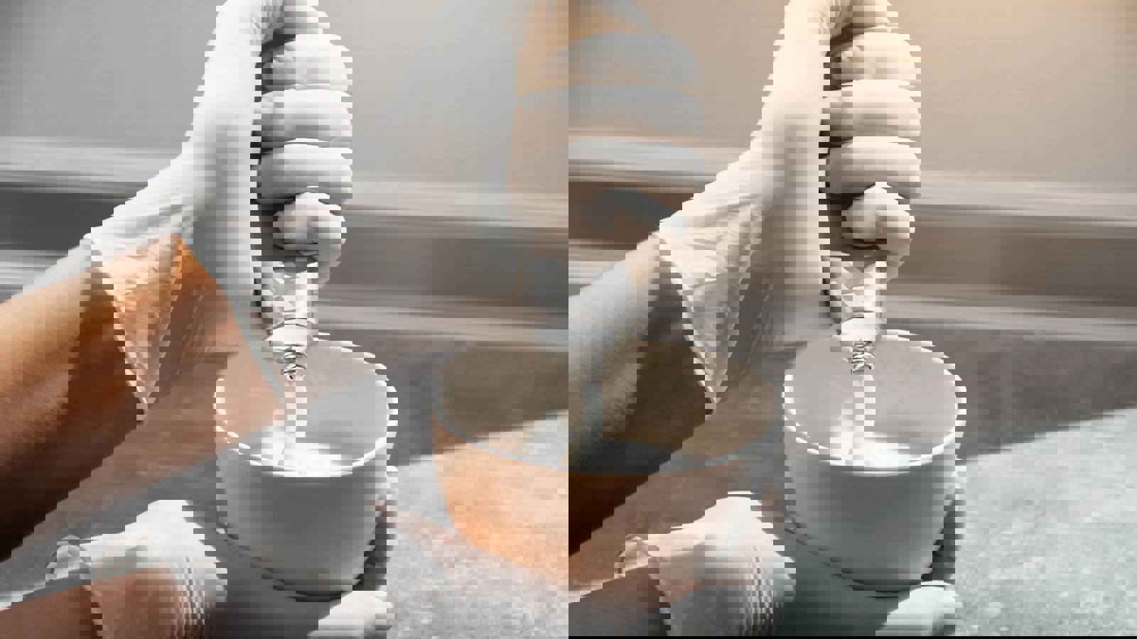 Hand squeezing cream from a tube