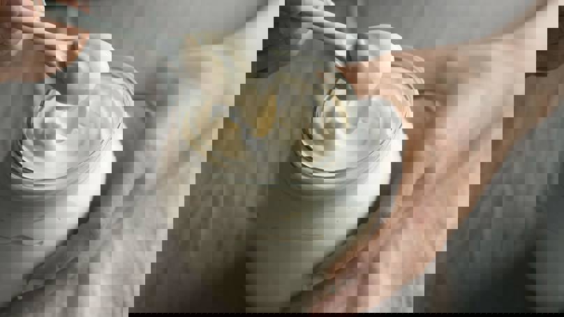 Person Scooping Mayonaise From A Jar