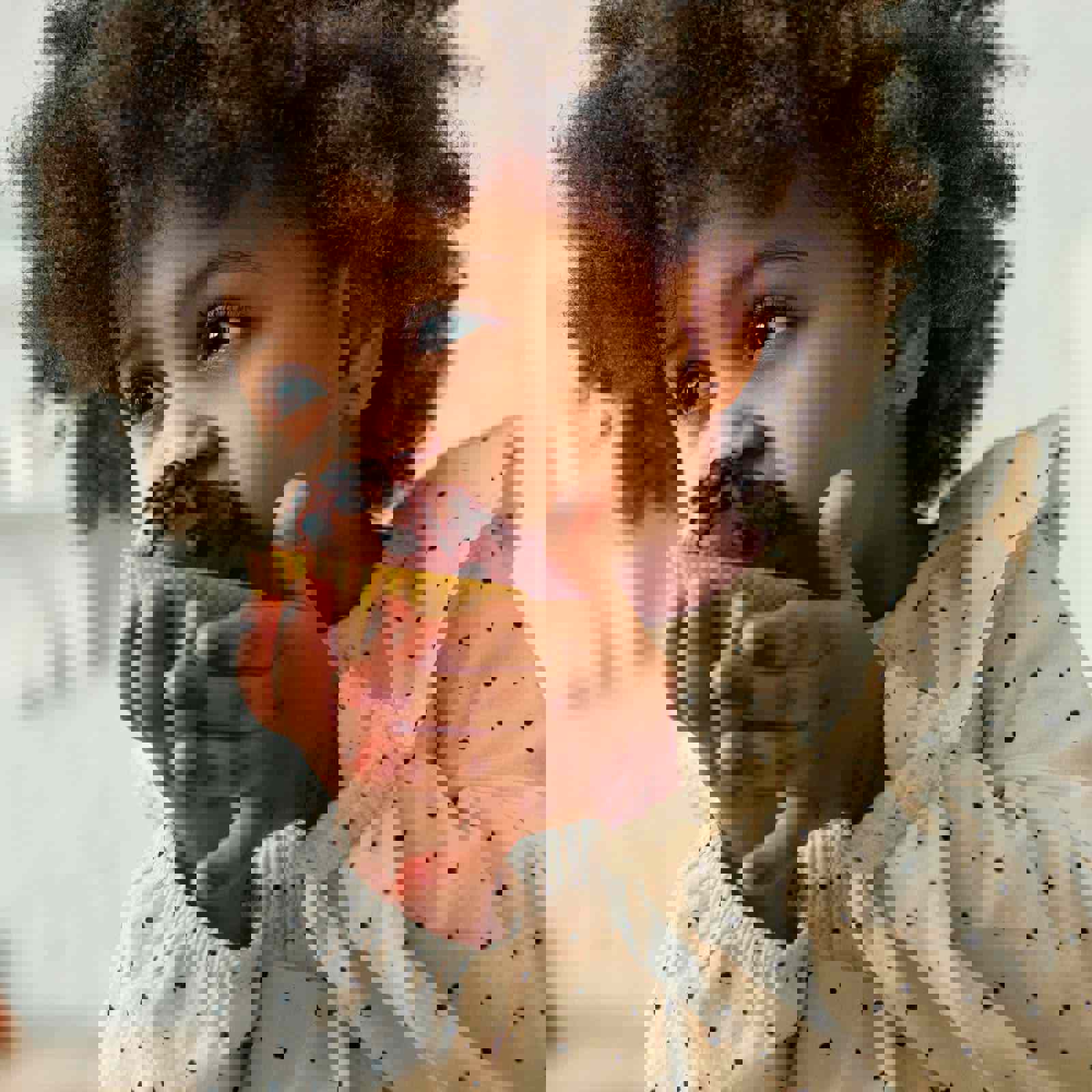 Child biting into a muffin