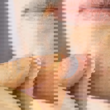 Woman applying anti acne master pimple patch with hydrocolloid dressing