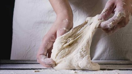 Person Stretching Dough