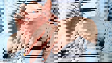 Female Hands Applying Hand Cream