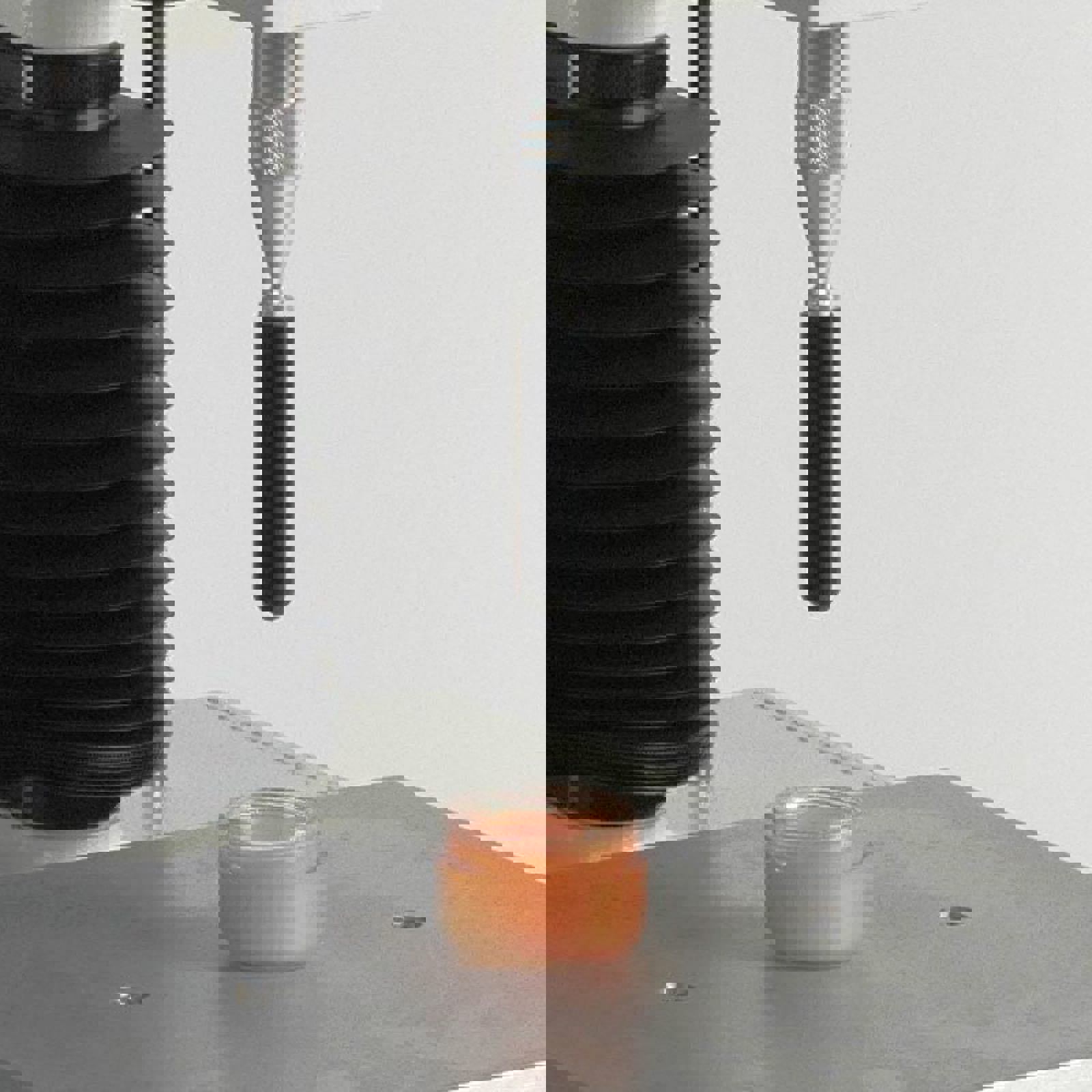 Hemispherical Probe attached to Texture Analyser testing cosmetic cream