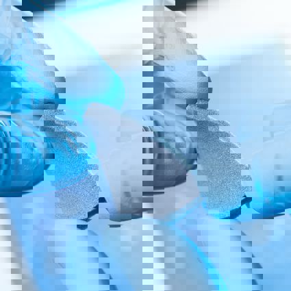 Researcher holding a sample of a new material