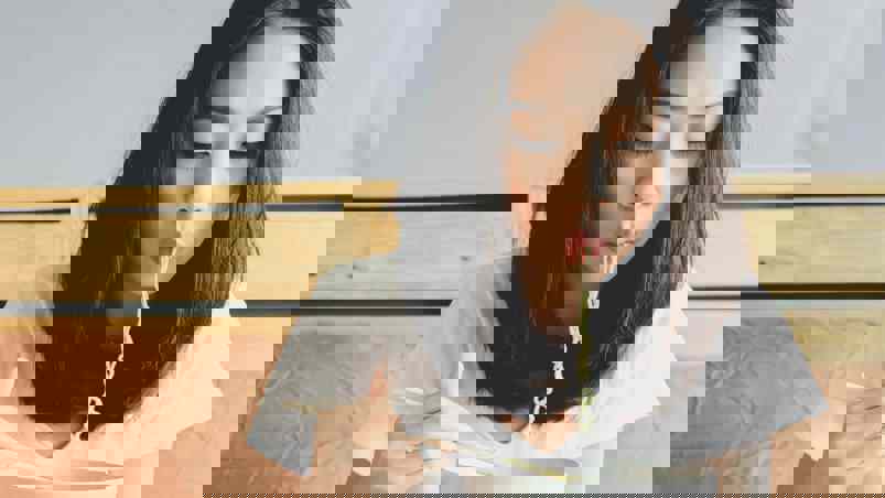 Person eating noodles