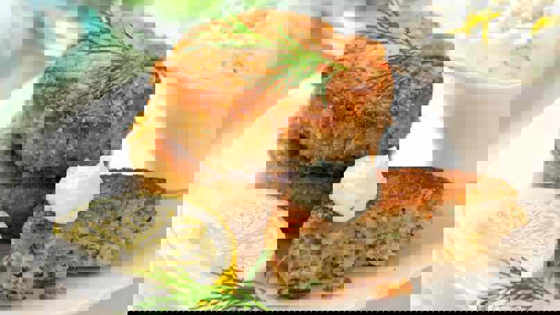 Fish Cakes Served With Lemon And Yoghurt Dressing