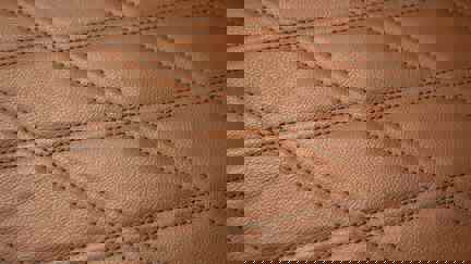Close Up Of Diamond Pattern Stitching On Leather