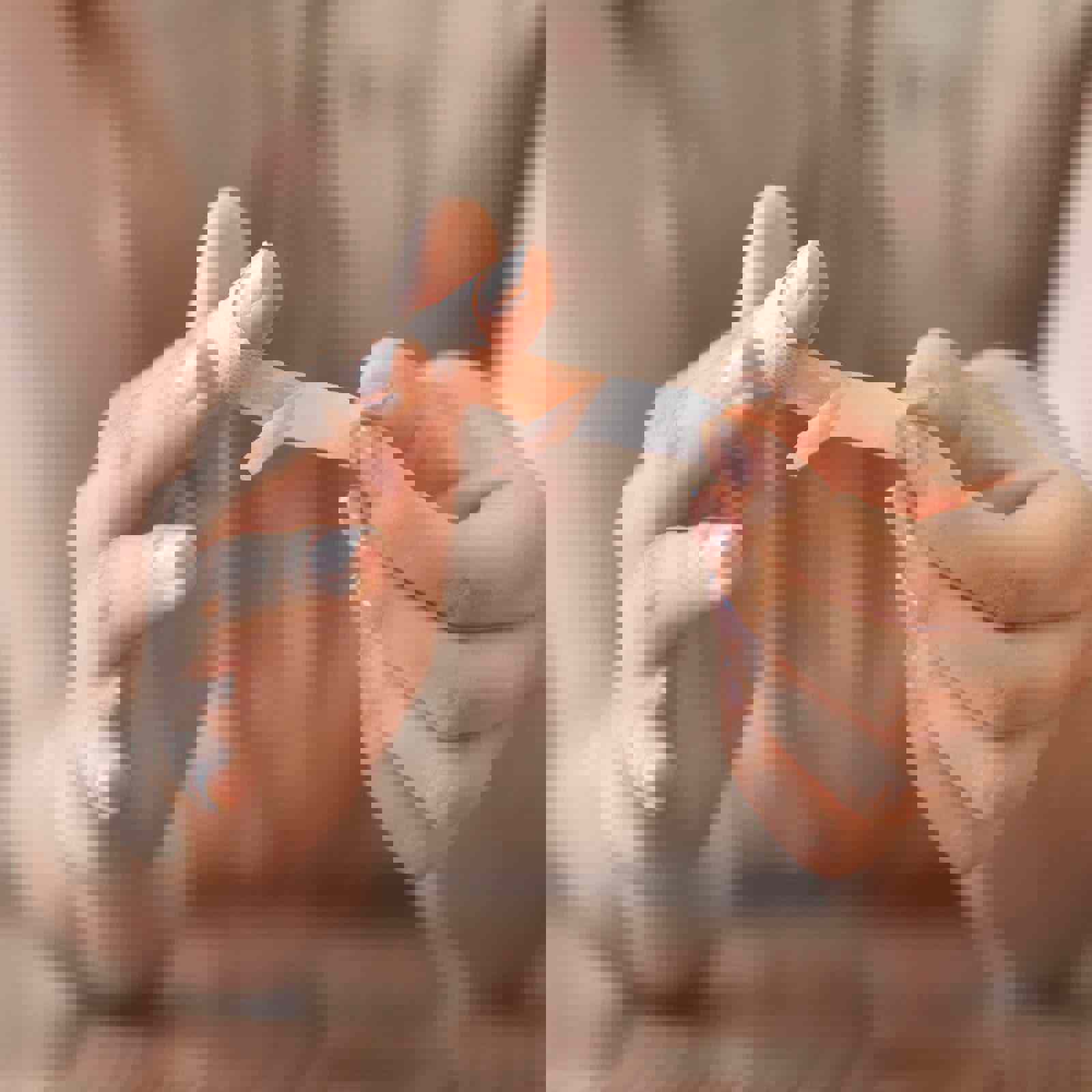 Person applying a plaster to their finger