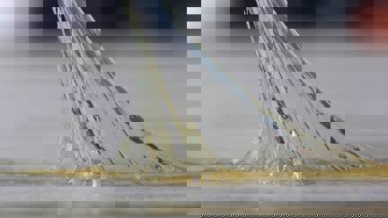 Adhesive substance stretching between two surfaces