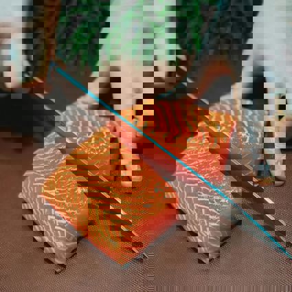 Person cutting raw salmon fillet