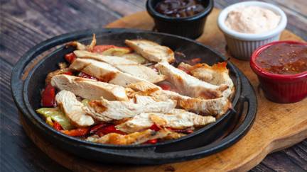 Plate Of Chicken Strips And Condiments