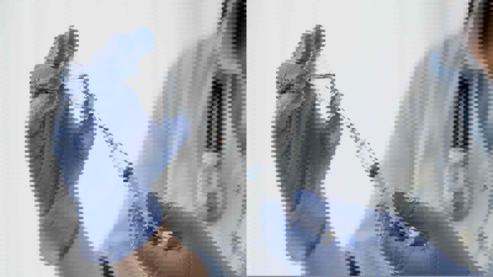 Doctor drawing medicine into a syringe