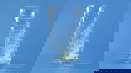 Glass Of Water With Effervescent Tablet Dissolving