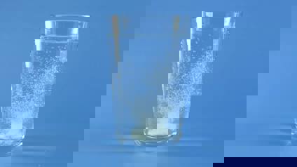 Glass Of Water With Effervescent Tablet Dissolving