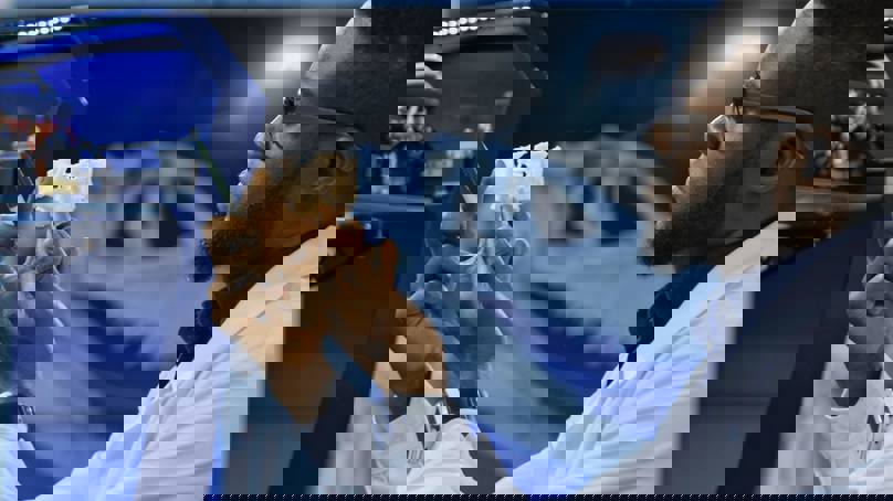 Researcher Examining 3D Printed Medical Component