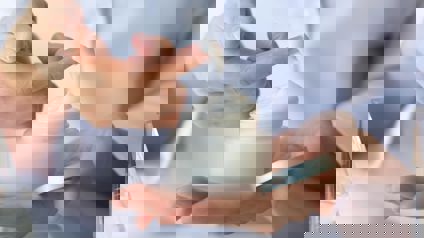 Person Holding Jar Of Face Cream