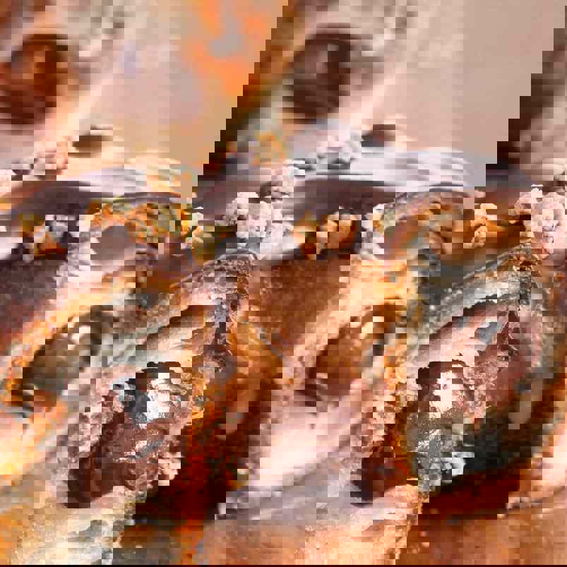 Cronut cut in half to reveal chocolate filling