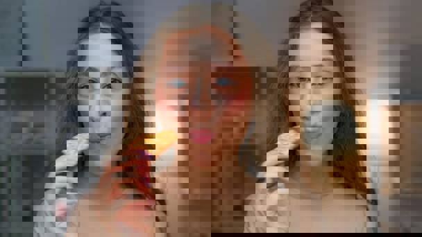 Woman Biting Into Cracker