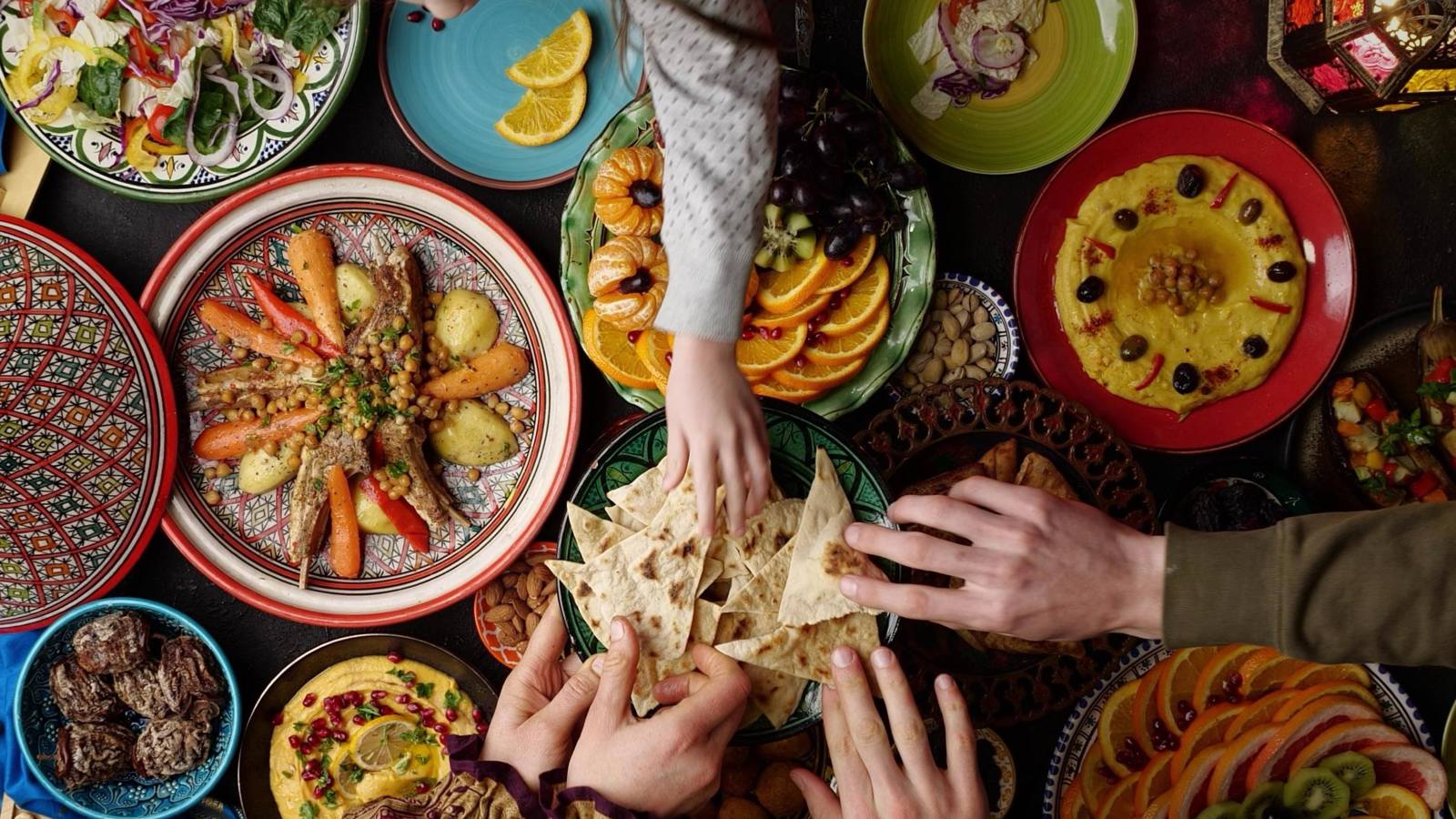 People sharing food from the Maghreb region