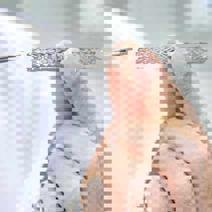 Clinician holding a stent