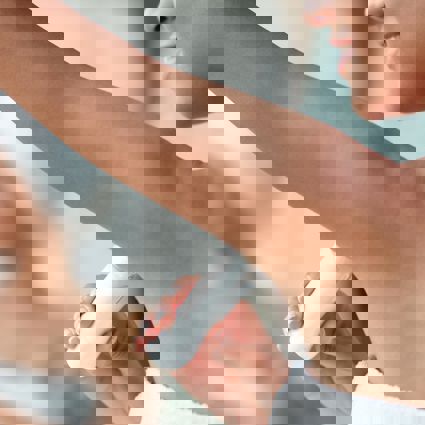 Person applying stick deoderant