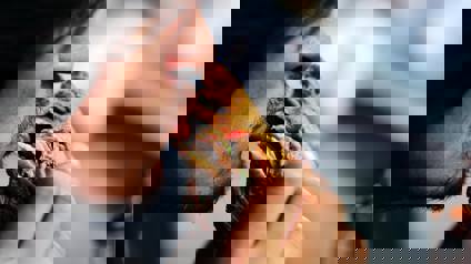 Man Taking A Big Bite