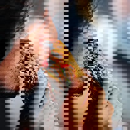 Man taking a big bite