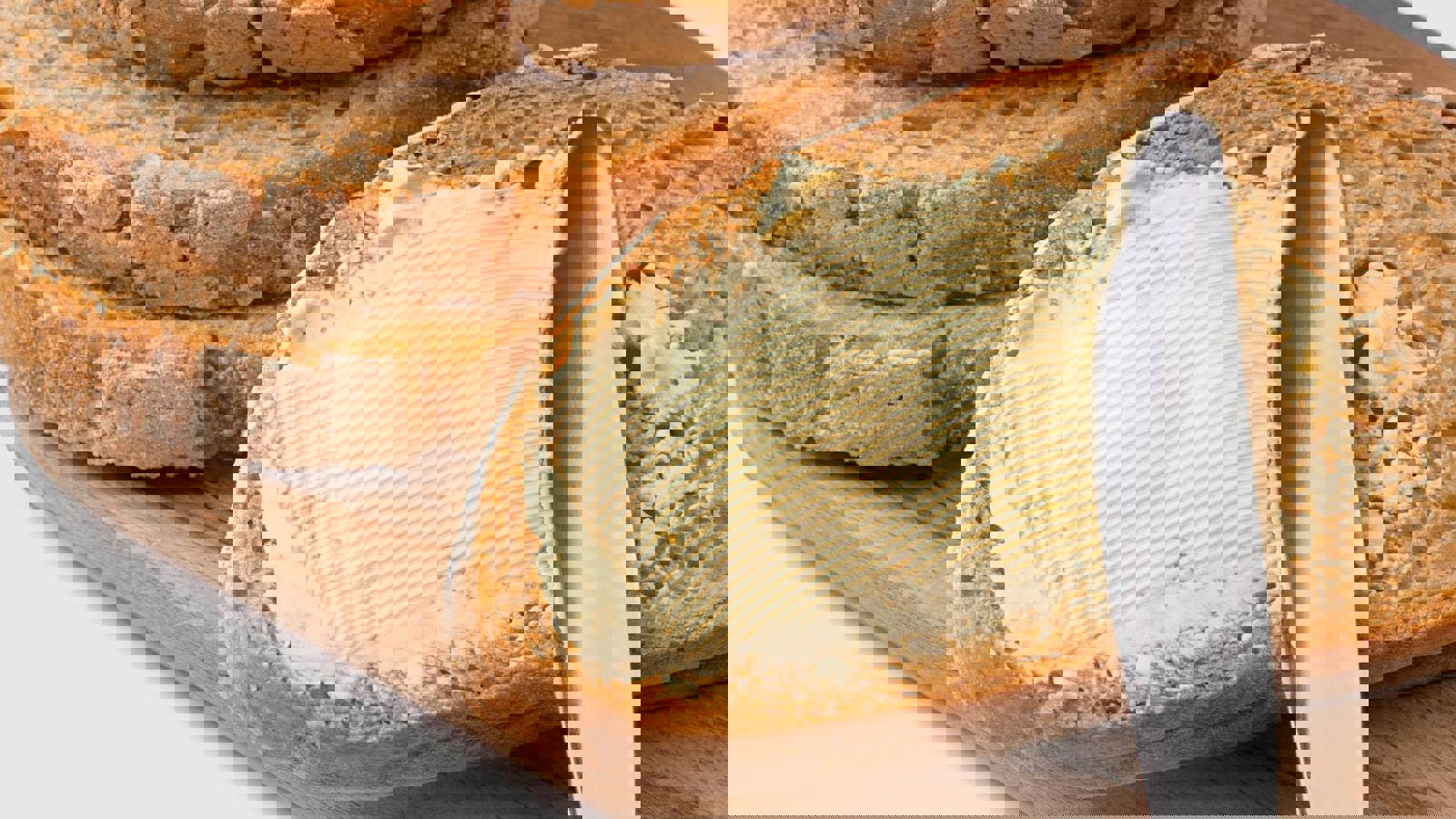 Spreading butter thickly on bread