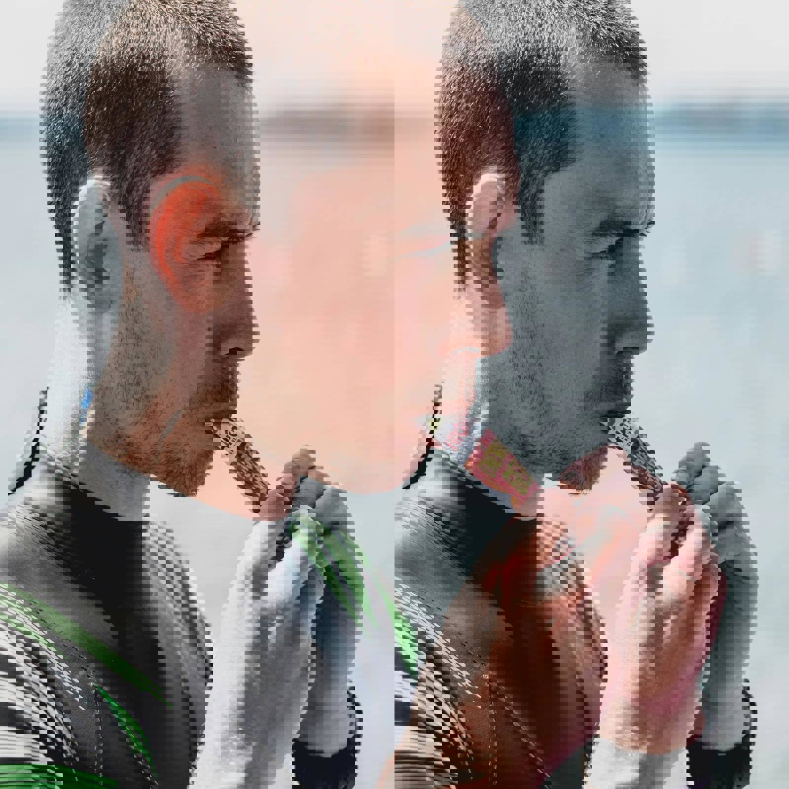 Person consuming an energy sachet