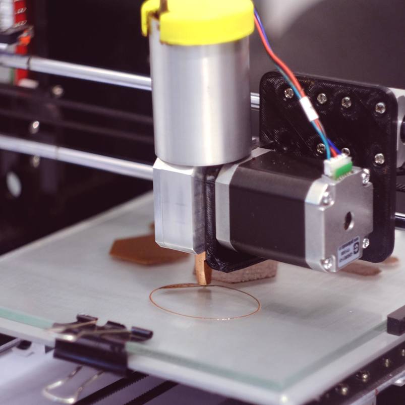 3D printer printing discs of chocolate