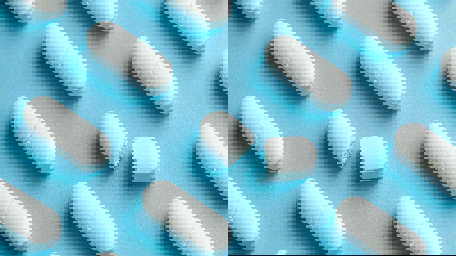 Pharmaceutical tablets, one broken in half
