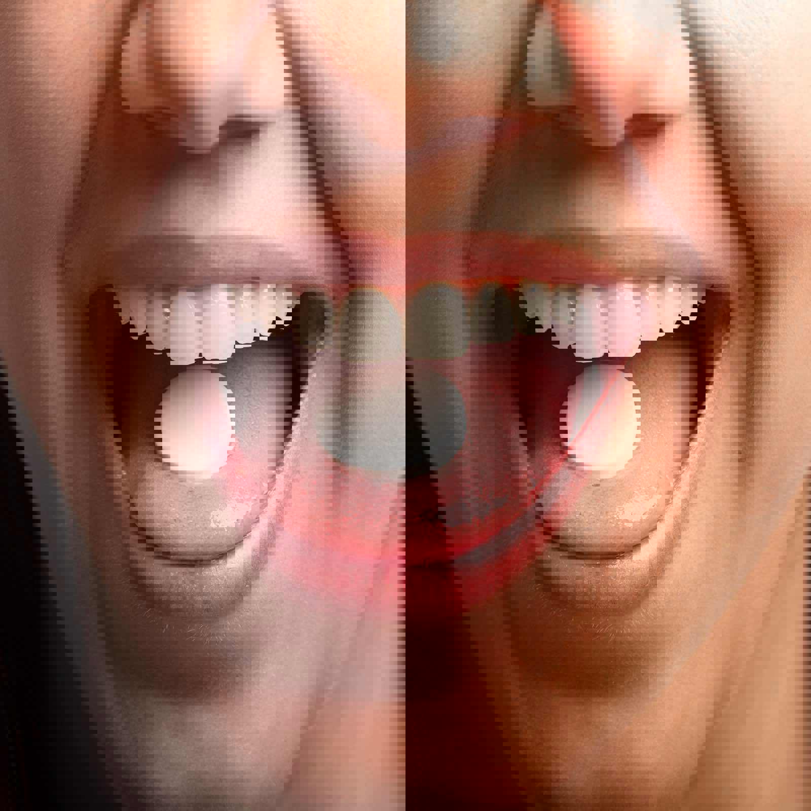 Person holding dissolvable tablet on their tongue