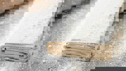Raw Puff Pastry On Floured Surface