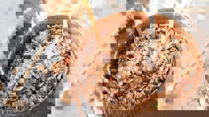 Milk Pouring Into Bowl Of Museli