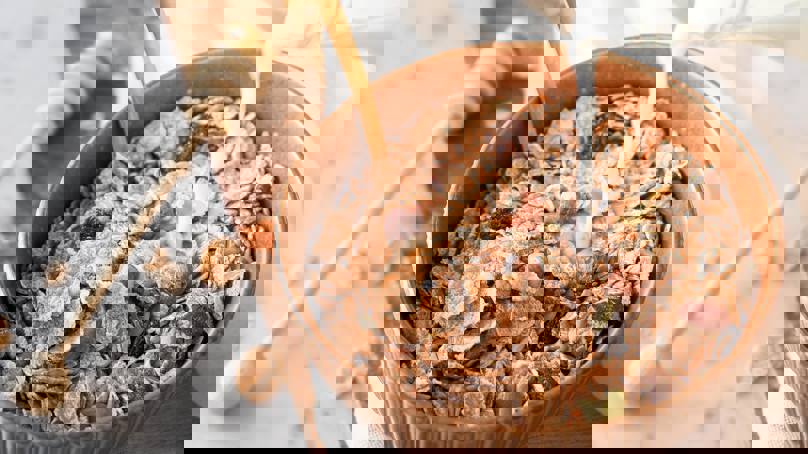 Milk Pouring Into Bowl Of Museli