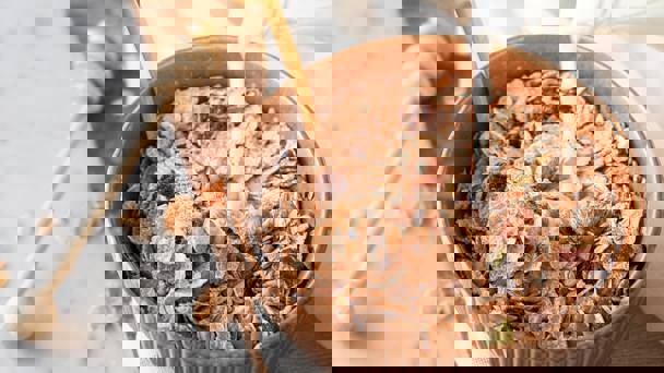 Milk Pouring Into Bowl Of Museli