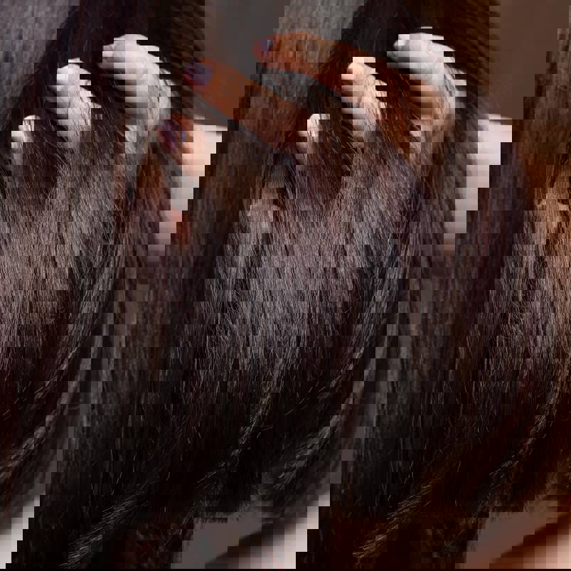 Person running fingers through hair