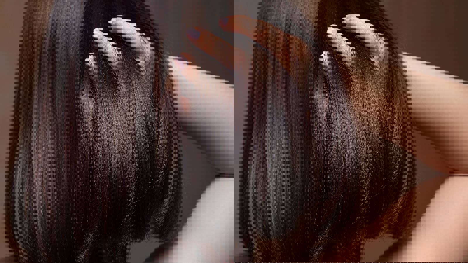 Person running fingers through shiny hair