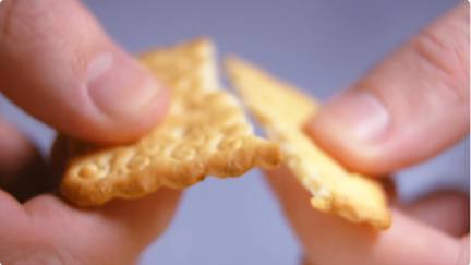 Cracker Being Snapped In Half