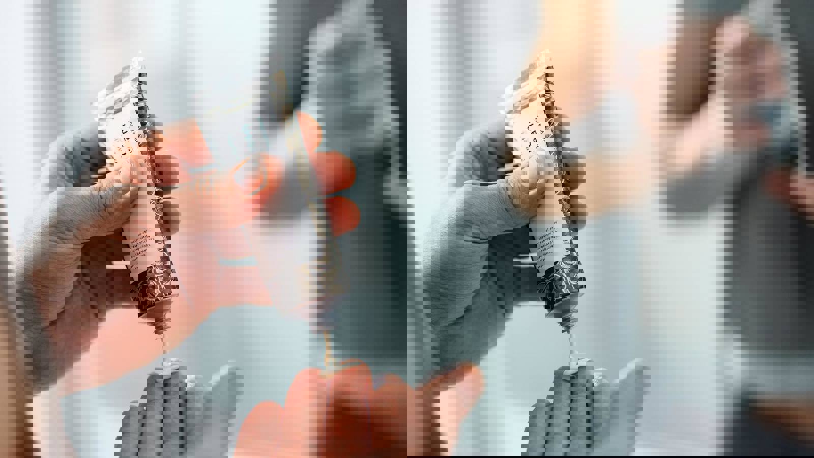 Person squeezing cream from a tube