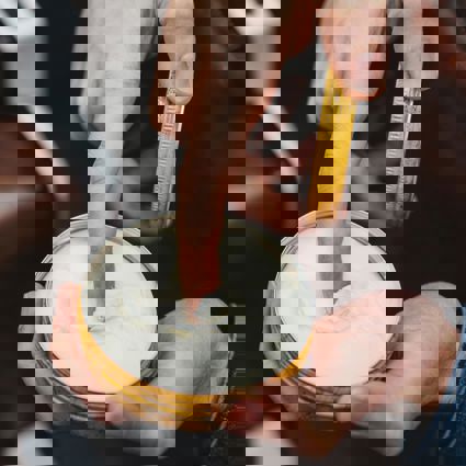 Using finger to remove hair product from tin