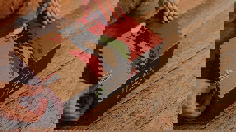 Hands Opening Cardboard Pizza Box