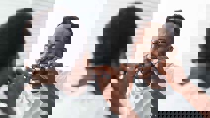 Person Flossing In Mirror